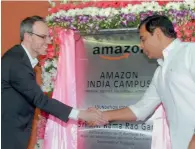  ?? PTI ?? Telangana IT Minister K T Rama Rao shakes hands with Amazon vice-president David Zapolsky at the laying of foundation stone for the new campus in Gachibowli in Hyderabad. —