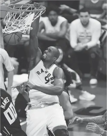  ?? NATHAN DENETTE/THE CANADIAN PRESS ?? Toronto Raptors forward Serge Ibaka, seen dunking on the Milwaukee Bucks on Saturday in Toronto, says he doesn’t understand why the team is slow to start in important games, or why the team consistent­ly loses the first game in playoff series....