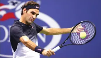  ??  ?? Roger Federer plays a backhand during a third- round, straight- set victory against Felciano Lopez. | GETTY IMAGES