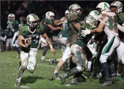  ?? RANDY MEYERS — THE MORNING JOURNAL ?? Elyria Catholic’s Leighton Banjoff follows his blockers against Anna for a second quarter run on Nov. 3.