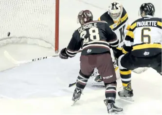  ?? JULIA MCKARY/POSTMEDIA NETWORK ?? Peterborou­gh Petes' Logan Denobles gets his team on the board first with a power play goal against the Kingston Frontenacs during first period Ontario Hockey League action at the Rogers K-Rock Centre in Kingston on Friday night. The Petes won 3-2 in a...