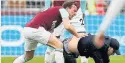  ??  ?? SHAME Mark Noble grapples with a fan