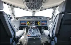  ?? CHRISTOPHE MORIN/BLOOMBERG ?? Airplane makers are mulling a smaller cockpit crew to ease a pilot shortage. Critics have safety concerns.