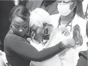  ?? JOE RAEDLE/ GETTY IMAGES ?? Tomika Miller, right, leaves the service for her husband, Rayshard Brooks, who was killed by police in Atlanta on June 12.