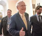  ?? NATHAN HOWARD/GETTY IMAGES ?? Senate Minority Leader Mitch McConnell, R-Ky., leaves the Senate chambers early Saturday morning after lawmakers passed the
$1.2 trillion government spending bill.