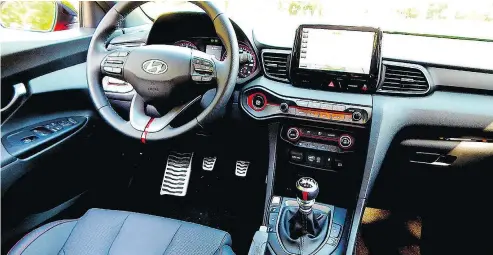  ??  ?? The Veloster N was designed by Hyundai’s high-performanc­e division, and it shows in the cabin.