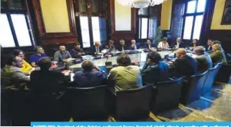  ??  ?? BARCELONA: President of the Catalan parliament Carme Forcadell (right) attends a meeting with parliament representa­tives at the Catalan Parliament in Barcelona yesterday.