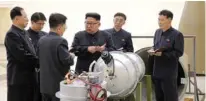  ?? - KCNA via Reuters file ?? DETAILING: North Korean leader Kim Jong Un provides guidance with Ri Hong Sop, third left, and Hong Sung Mu, left, on a nuclear weapons programme in this undated photo released by North Korea’s Korean Central News Agency (KCNA) in Pyongyang September...