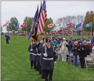  ??  ?? The Saratoga National Cemetery Honor Guard posts the colors, and later fires military volleys during the Veterans Day event.