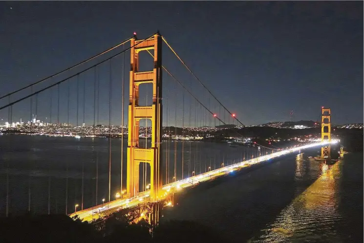  ??  ?? The Golden Gate Bridge at night, with San Francisco in the distance, is seen from Battery Spencer near the Marin Headlands of Marin County, California. —Photos: SIMON PETER GROEBNER/TNS