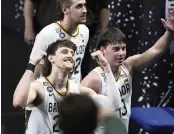  ?? DARRON CUMMINGS AP ?? Baylor guard Matthew Mayer, left, celebrates as he walks off the court at the end of the Bears’ victory over Houston in the Final Four semifinals.