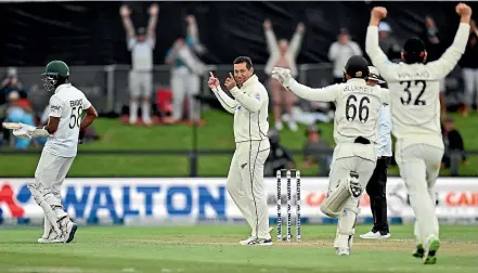  ?? GETTY IMAGES ?? Ross Taylor (centre) farewelled test cricket in style taking the last Bangladesh wicket at the bowling crease to complete New Zealand’s victory by an innings and 117 runs.