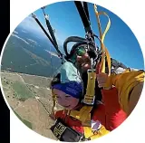  ??  ?? Left: Stella Brown, centre, gets ready to skydive from 12,000 feet above Lake Taupo. The videograph­er [left] filmed her jump.