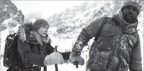  ??  ?? Kate Winslet and Idris Elba in a scene from “The Mountain Between Us”