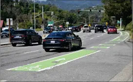  ?? ?? Traffic rolls west on Tiburon Boulevard toward Highway 101next to a bike lane in Tiburon.