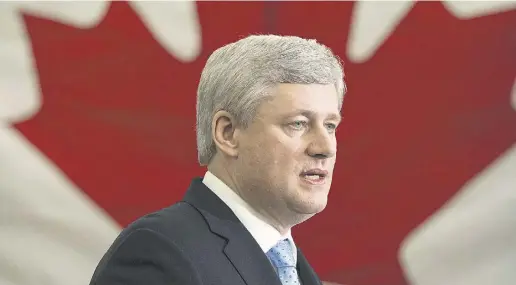  ?? PAUL CHIASSON / THE CANADIAN PRESS ?? Prime Minister Stephen Harper took a tough line on face coverings while speaking in Victoriavi­lle, Que., on Thursday.