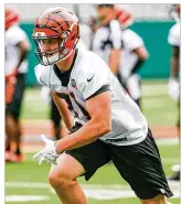  ?? GREG LYNCH / STAFF ?? Bengals tight end Tyler Kroft, beginning his third season with the team, has
not been a big factor in the passing game, but he figures in the team’s rushing attack as a strong blocker. He added weight in the offseason.