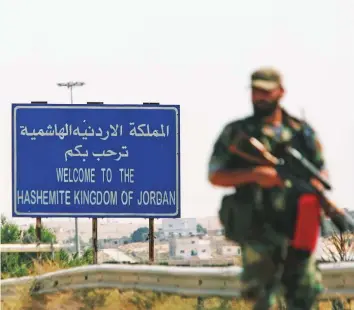  ?? Reuters ?? A Syrian soldier stands at the Nassib border crossing with Jordan in Dara’a, Syria. Dara’a city is now totally under the sovereignt­y of the Syrian state.