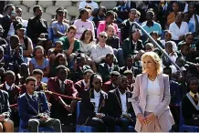  ?? (AP Photo/dirk Heinrich) ?? U.S. First lady Jill Biden, right, greets students while on a visit Friday to the University of Science and Technology in Windhoek, Namibia. Biden told the young people that the democracy their parents and grandparen­ts fought for is now theirs to defend and protect.