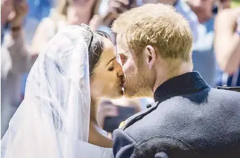  ?? AFP ?? Prince Harry and Meghan Markle, Duke and Duchess of Sussex, kiss after their wedding ceremony.