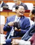  ?? PHA LINA ?? Prime Minister Hun Sen, seen through a door at a National Assembly session in February where controvers­ial changes to the Law on Political Parties were approved.