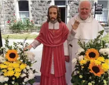  ??  ?? Well done to the Dominican for the superb job at the front of the church for the recent St Oliver Plunkett procession. Fr Jim Donleavy was on hand to step in for a picture.