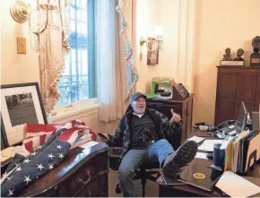  ?? GETTY IMAGES ?? A Trump supporter sits inside the office of House Speaker Nancy Pelosi inside the U.S. Capitol in Washington, D.C.