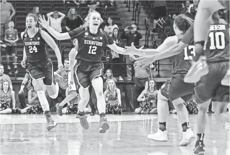  ?? AARON DOSTER, USA TODAY SPORTS ?? Erica McCall (24), who had the pivotal block to seal the win, and Brittany McPhee (12) celebrate the Cardinal’s win.