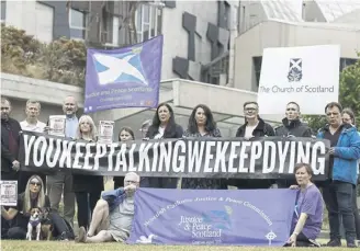  ?? PICTURE: JEFF J MITCHELL/GETTY IMAGES ?? Campaign group Faces And Voices of Recovery protests outside Holryood in 2022