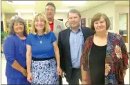  ?? Westside Eagle Observer/SUSAN HOLLAND ?? David Bailey (center), lieutenant governor of MOARK District 19 Kiwanis, poses with new 2018-19 officers of the Gravette Kiwanis Club after installing them at a dinner meeting Monday, Sept. 24. Pictured are Brenda Yates, secretary; Dr. Nancy Jones, president; Kurt Maddox; president-elect; and Lavon Stark, past president. Treasurer Malcolm Winters was unable to attend.