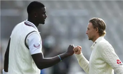  ??  ?? West Indies’ Jason Holder and the England captain, Joe Root, fist bump during last summer’s Test series. Photograph: Gareth Copley/Getty Images for ECB