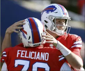  ?? RON SCHWANE - THE ASSOCIATED PRESS ?? Buffalo Bills quarterbac­k Josh Allen, right, celebrates with guard Jon Feliciano after throwing a touchdown pass to Cole Beasley in the second half of an NFL football game against the Miami Dolphins, Sunday, Oct. 20, 2019, in Orchard Park, N.Y.