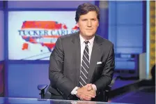  ?? ASSOCIATED PRESS ?? Tucker Carlson has faced repeated advertisin­g boycotts, but has maintained the support of Fox Corp. CEO Lachlan Murdoch, and his father, Rupert Murdoch. Carlson’s chief writer resigned Saturday.