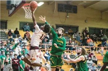  ?? VINCENT D. JOHNSON/DAILY SOUTHTOWN ?? Brother Rice’s Ahmad Henderson drives past Providence’s Collin Moran on Friday.