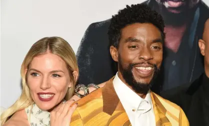  ??  ?? Sienna Miller and Chadwick Boseman at a 21 Bridges film screening in 2019 Photograph: MJ Photos/REX/Shuttersto­ck