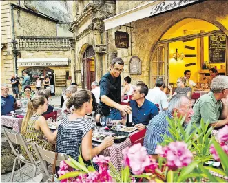  ?? DOMINIC ARIZONA BONUCCELLI ?? Lingering in outdoor cafés is the norm in France — make sure to eat long and well.