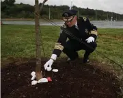  ?? Nancy lane / Herald staFF ?? WRITTEN ON STONE: A memorial stone is left Thursday by Groveland Police Chief Jeffrey Gillen at the Kraft Family 9/11 Memorial Garden outside Gillette Stadium in Foxboro.