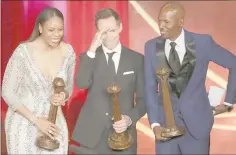  ??  ?? Naismith Memorial Basketball Hall of Fame Class of 2018 enshrinees (from left) Tina Thompson, Steve Nash, and Ray Allen stand on stage during the 2018 Basketball Hall of Fame Enshrineme­nt Ceremony at
