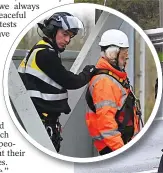  ?? ?? Officers lower a man on to M25 at Junction 28, Essex