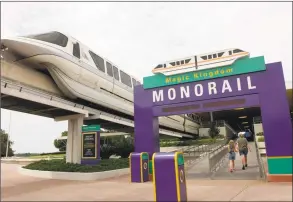  ?? Scott Audette / Associated Press ?? A Walt Disney World monorail pulls away from the main transporta­tion station in Lake Buena Vista, Fla.