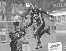  ?? CLAUDE PARIS/AP ?? Daniel Ricciardo of Australia jumps from his car to celebrate after winning the Monaco Grand Prix on Sunday in Monaco.