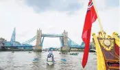  ??  ?? Thames tribute: royal barge Gloriana leads the Queen’s 90th birthday flotilla along the Thames by Tower Bridge yesterday