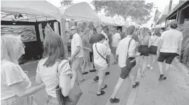  ??  ?? People gather in downtown Fort Lauderdale for the 32ndAnnual Las Olas Art Fair, Saturday, January 4,2020.