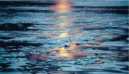  ?? DAVID GOLDMAN/AP 2017 ?? The midnight sun shines across sea ice along the Northwest Passage in the Canadian Arctic Archipelag­o.