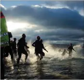  ?? Photo: PHILIP DYER ?? Big swim: Triathlete­s take to the water at Scorching Bay.
