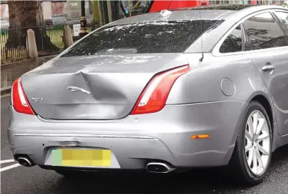  ??  ?? Prang: The PM’s £54,000 Jaguar XJ was left with a large dent in the boot but no one was hurt