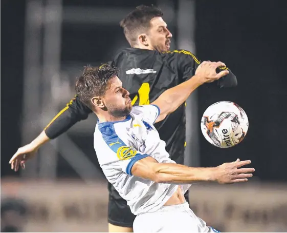  ?? Picture: GETTY IMAGES ?? City’s Sam Smith, jostling against Moreton Bay, said he’d be more than happy to face an A-League side in the next round of the FFA Cup.