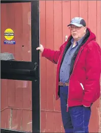  ?? RYAN ROSS/THE GUARDIAN ?? Leonard Green holds the door for people exiting the provincial courthouse Monday after his case was adjourned. Green is awaiting sentencing for attempted rape and indecent assault.