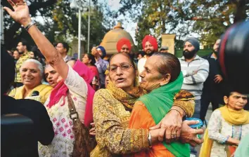  ?? PTI ?? Family members of victims of 1984 anti-Sikh riots celebrate outside the Patiala House Court in New Delhi, yesterday after the pronouncem­ent of the first death punishment in the case.