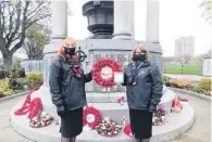  ??  ?? Poignant time Remembranc­e Sunday was marked very differentl­y in Monklands, with 1st Coatbridge Girls’brigade captain Linzi Munro and lieutenant Irene Krebs among those paying socially distanced respects